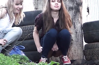 Voyeur spying girls pissing open-air